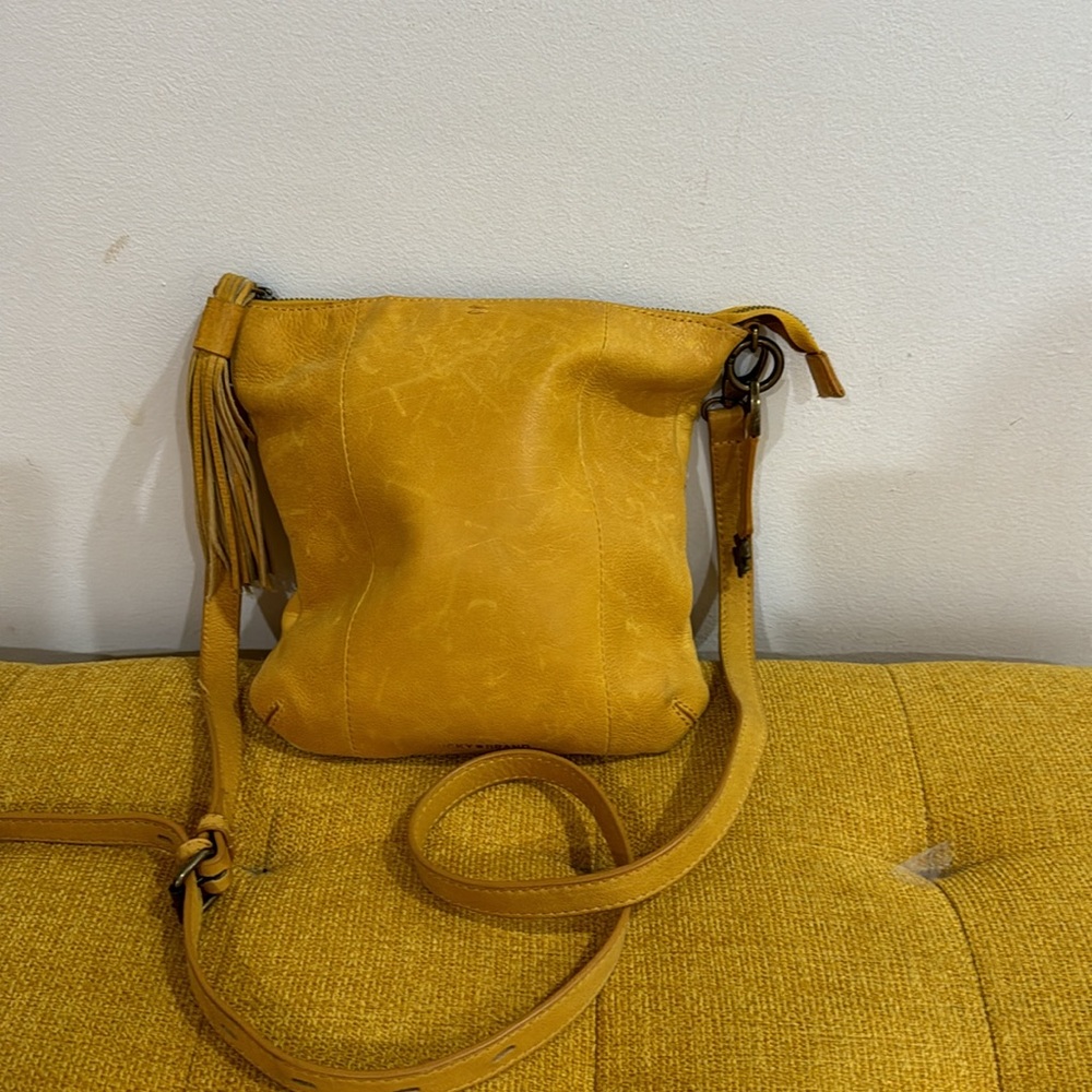 A Lucky gently used 100% leather yellow crossbody bag🍀🍀🍀